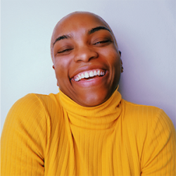Photo of Cyrah Ward, smiling and wearing a yellow sweater