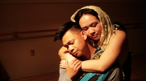 A woman backhugging a man